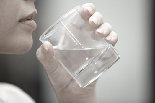 Woman holding glass with potable water