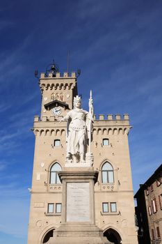 Statue of Liberty against parliament building in San Marino, Italy