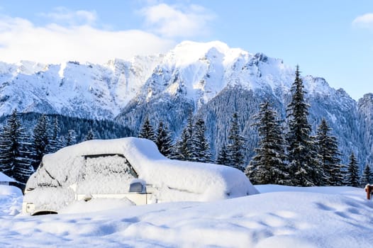 car blockaded in snowy mountains