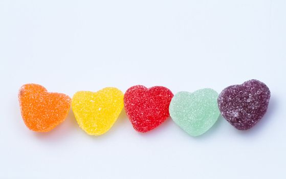 colorful Love-shaped jelly on white surface  for backround use