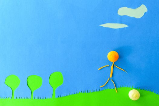 child playing ball on blue background