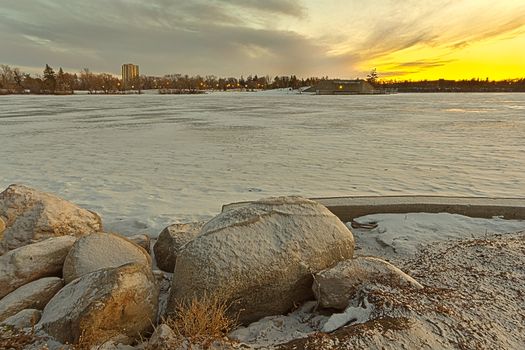 Wascana lake frozen on a cold November day during winter in Regina, Canada.