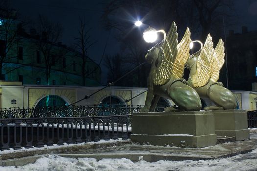 Night horizontal view of Griffons on Bank Bridge in st. Petersburg, Russia