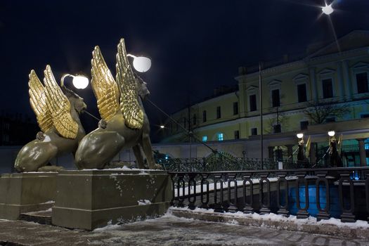 Night horizontal view of Griffons on Bank Bridge in st. Petersburg, Russia