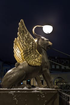 Night vertical view of Griffons on Bank Bridge in st. Petersburg, Russia