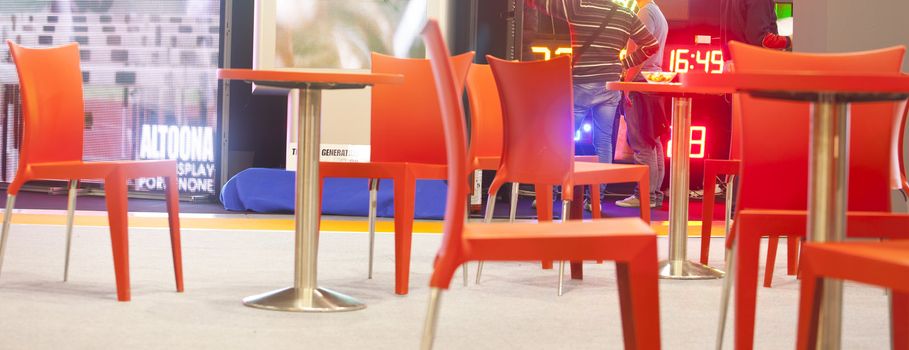 Photo of red chairs of a pub