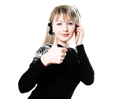 beautiful young woman with headphones listening to music and shows that she likes