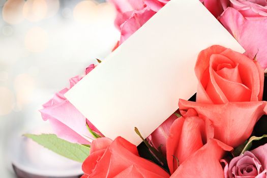 Blank card with a dozen roses. Shallow depth of field with copy space.