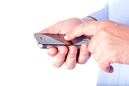 Hand holding a smart phone isolated on a white background