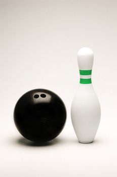 Bowling ball and pin isolated on white