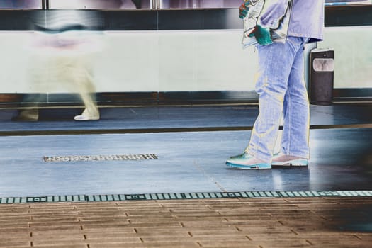 Photo of the feet that walk on the sidewalk