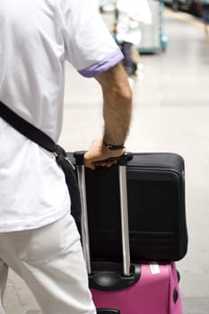 Detail of a man with luggage