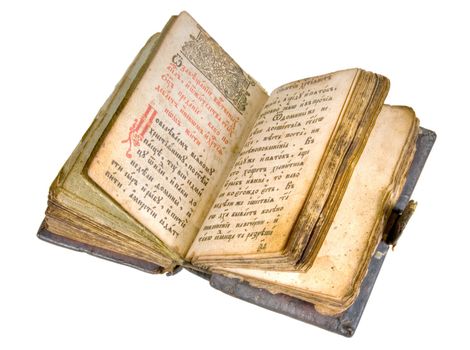 The ancient book in leather reliure on a light background.