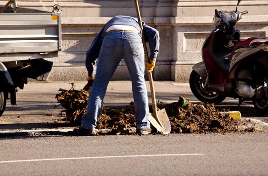 Workers in action in the street