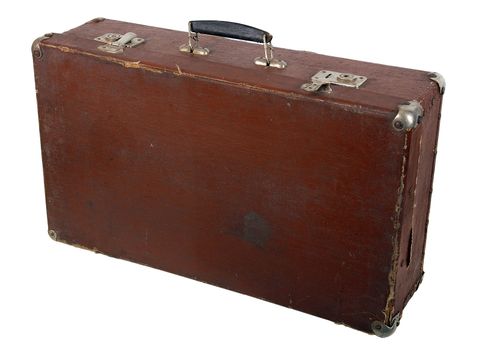 Old brown suitcase on a light background.