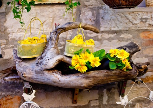 Fake chicks in baskets and fake flowers