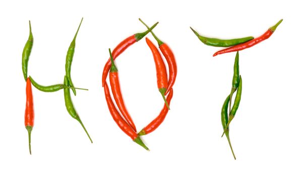 Word "Hot" from Red and Green Chilli Hot Peppers  on white background