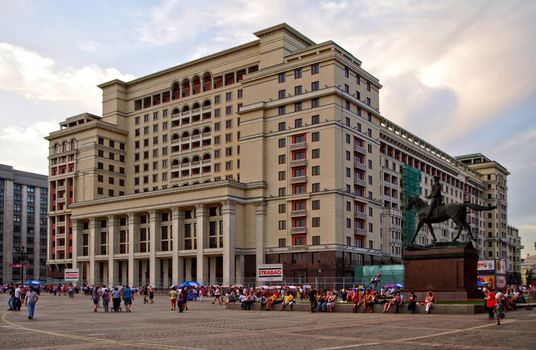 Moscow, Russia - June 26, 2010: Summer day. Peoples walks near the Hotel Moscow and Zhukov monument on June 26, 2010 in Moscow, Russia