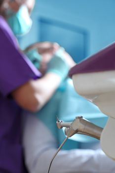 Interesting perspective in a dental office, selective focus on the drill.