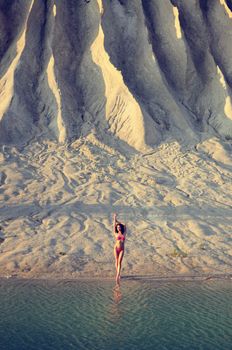 woman posing in beach. sunset