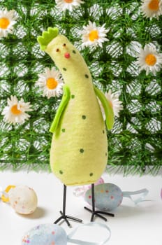 Easter chicken/cock with eggs and green grass