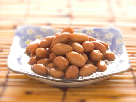 close up of a bowl of braised peanuts