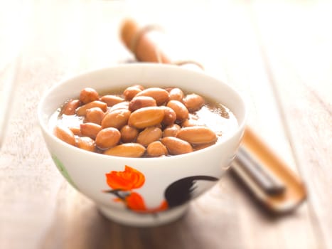 close up of a bowl of braised peanuts