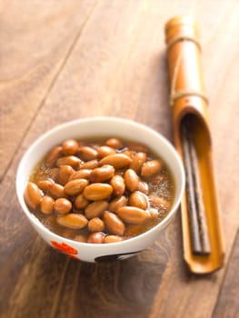 close up of a bowl of braised peanuts