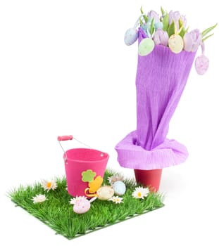 Bouquet from tulips and easter eggs on the grass