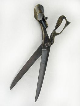 old metal scissors on a light background