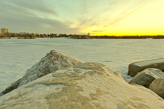 Wascana lake frozen on a cold November day during winter in Regina, Canada.