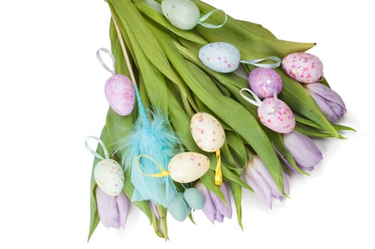 Easter eggs and tulip bouquet isolated on white