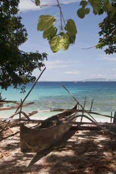 The view of a canoe on the beach, Sulawesi, Indonesia