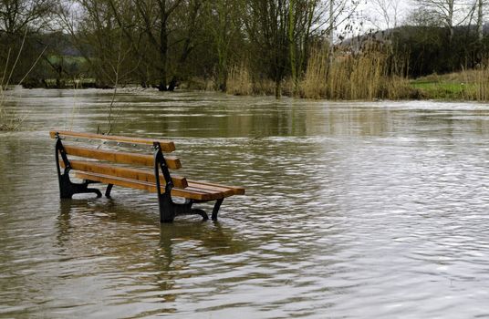 a bench surrounded by water