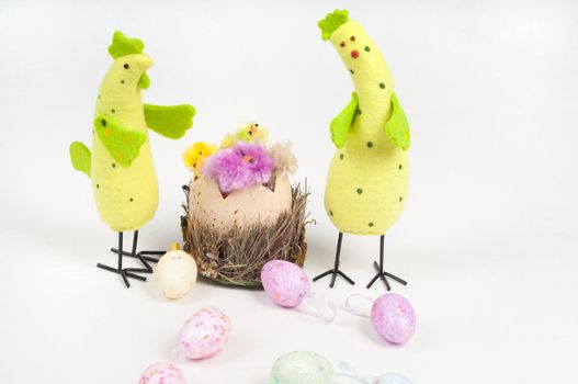 Easter chicken and cock with eggs on light background
