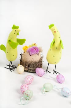 Easter chicken family with tulips and eggs on light background