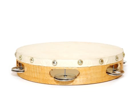 wood and leather tambourine on white background