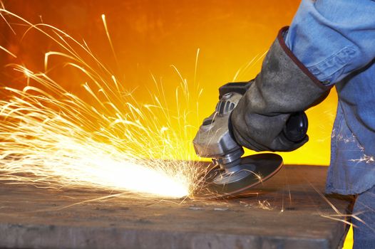 a close up picture of sparks on a grinding wheel