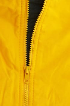 a macro picture of a yellow zipper