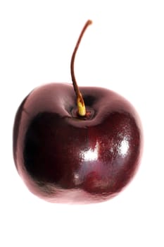 The image of a sweet cherry with a drop on a white background