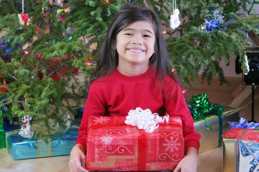 Child with Christmas gifts