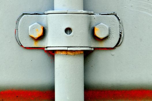 Bolts and a clamp give the appearance of being a face