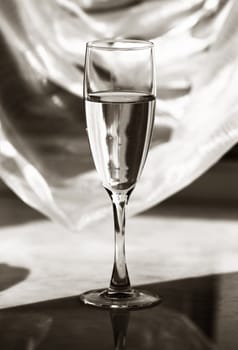Glass with champagne. b/w+sepia