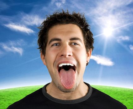 Yound man screaming, shouting and smiling with his tongue out.