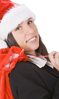 Portrait of a young businesswoman with a red Santa hat and bag.