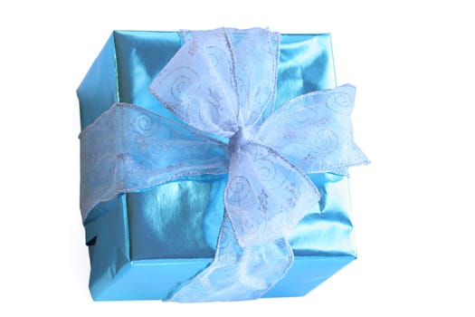 Elegant sky blue colored present with silver ribbons and bow isolated on white.