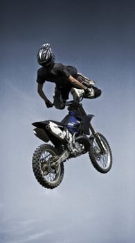 Freestyle motocross rider jumping