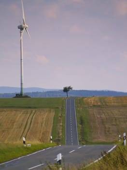 road through cultivated land in german low mountain range, Upland, Hessen