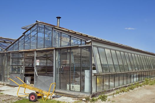 External view of a glasshouse against a blue sky