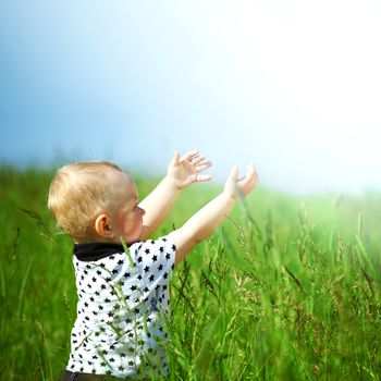 boy joy in green grass